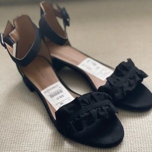 Classic sandal with 1” block heel. Perfect transitional styling in faux suede.